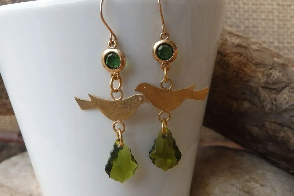 Pigeon gold dangle earrings