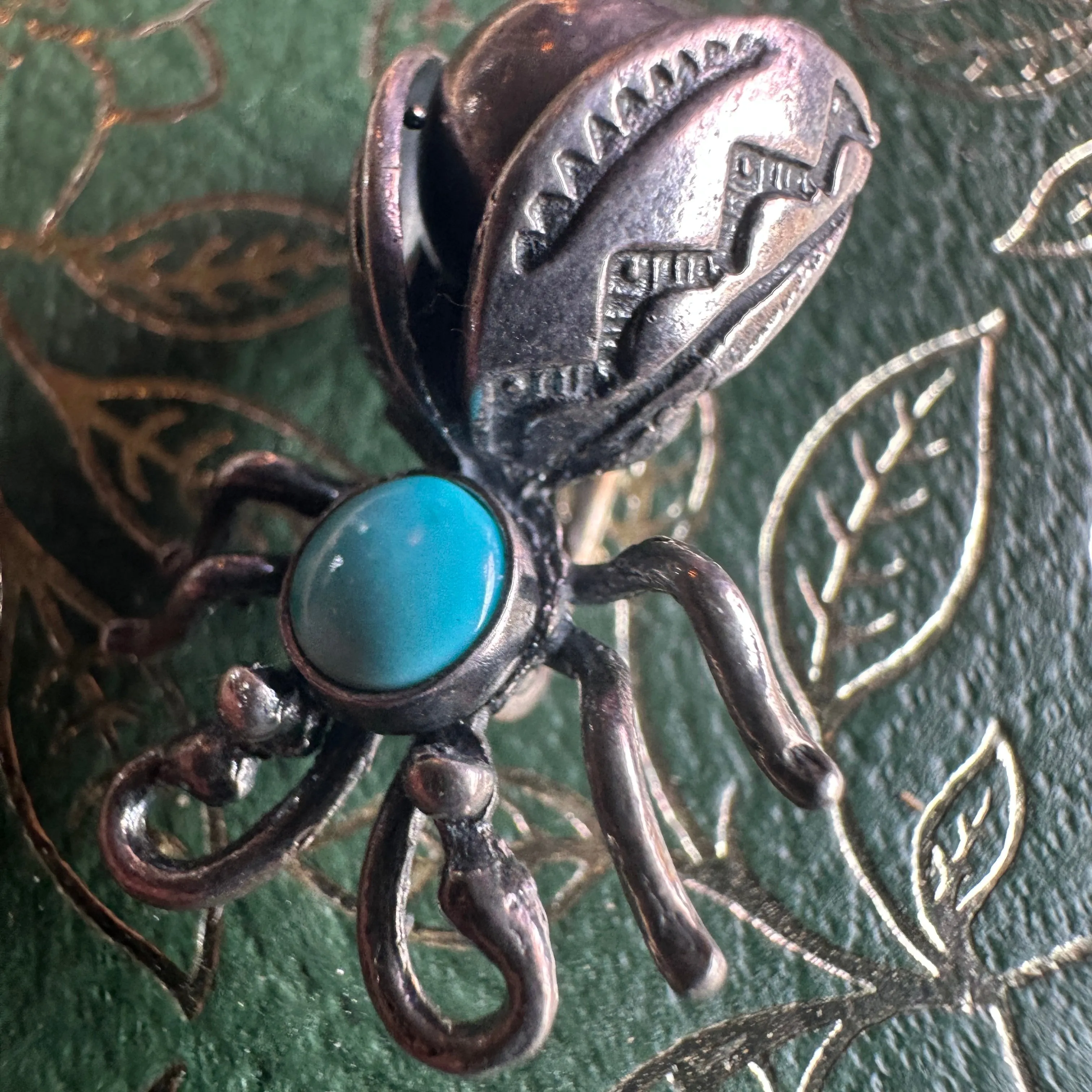 vintage sterling silver and turquoise Navajo firefly brooch